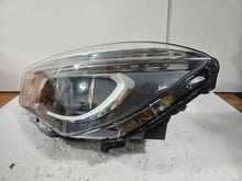 Load image into Gallery viewer, This image shows the left-side Xenon headlight for the Mercedes-Benz CLA Class C117, featuring original OEM quality with part number A1179065100. The headlight is a used but genuine component, designed to perfectly fit the left side of the CLA C117 model. It includes the factory-built Xenon lighting system and showcases the durable construction expected from Mercedes-Benz parts.