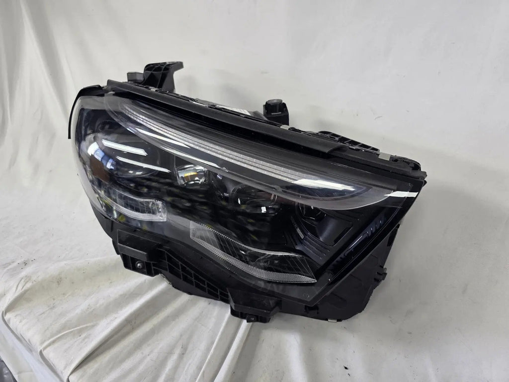 This image showcases the OEM genuine DIGITAL LIGHT headlights for the Mercedes-Benz E-Class W214, available for both right and left sides with part numbers A2149066102 (right) and A2149066202 (left). These advanced headlamps are original Mercedes-Benz components designed for the W214 model, offering cutting-edge DIGITAL LIGHT technology that enhances driving safety and precision lighting. The headlights are used but maintain high-quality OEM standards and are ideal replacements for the corresponding side.