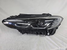 Load image into Gallery viewer, Used genuine BMW LED headlight for 4 Series models including G22, G23, G26, G80, G82, and G83. This left-side OEM headlamp, part number 9851035, is designed to perfectly fit and function in compatible BMW vehicles. The image shows the original BMW LED headlight in used condition with visible connectors, housing, and lens – ideal for replacement or repair of your vehicle’s front lighting system.