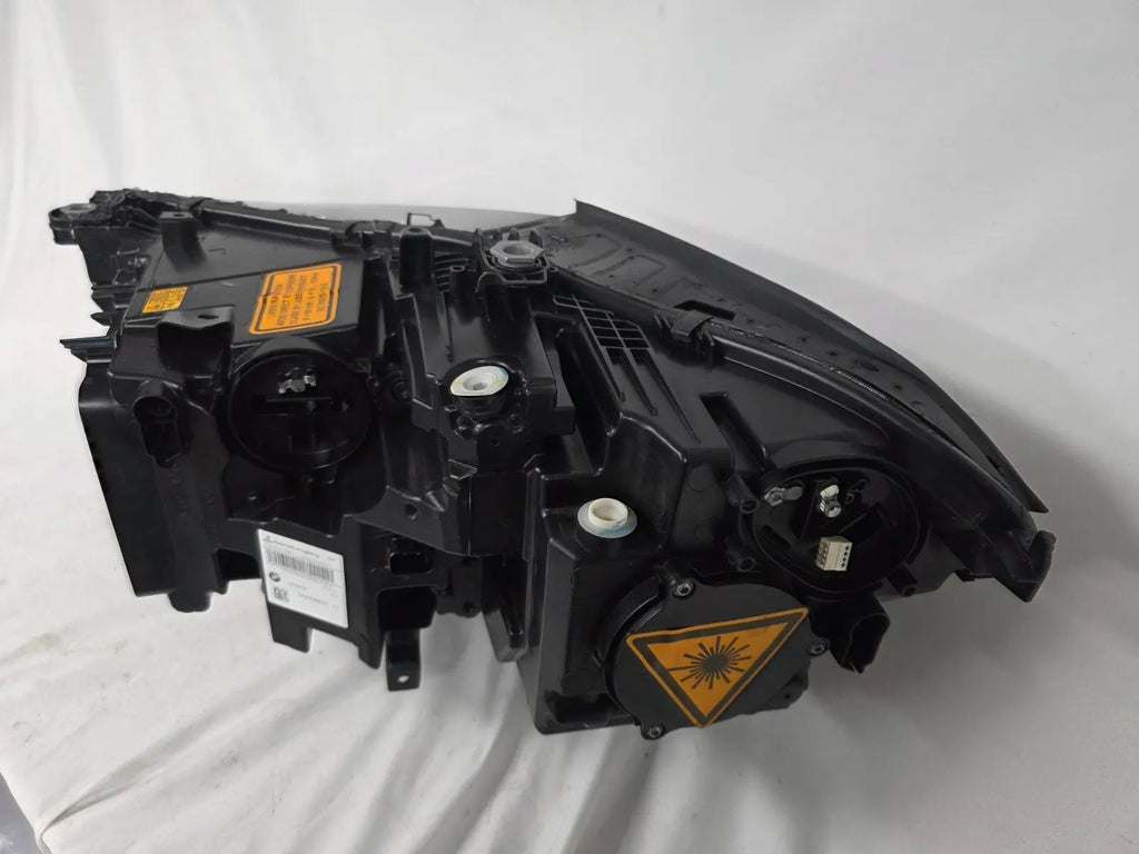 This image displays the right-side Laser headlight for BMW models X5 G05, X5 M F95, X6 G06, and X6 M F96, featuring OEM genuine quality with part number 5A27998. This used original headlamp delivers cutting-edge BMW Laserlight technology, offering enhanced night visibility, precise fitment, and a sleek, high-performance design tailored for these luxury SUV models.