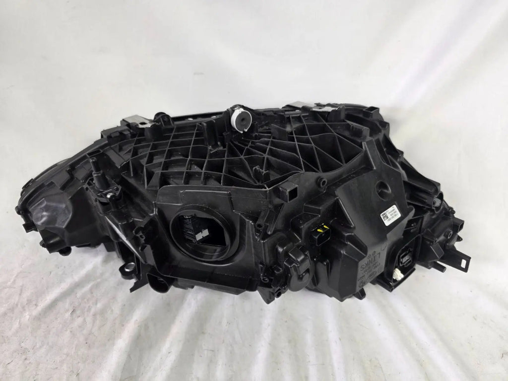 Used genuine BMW LED headlight for 4 Series models including G22, G23, G26, G80, G82, and G83. This left-side OEM headlamp, part number 9851035, is designed to perfectly fit and function in compatible BMW vehicles. The image shows the original BMW LED headlight in used condition with visible connectors, housing, and lens – ideal for replacement or repair of your vehicle’s front lighting system.