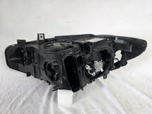 Load image into Gallery viewer, Genuine used BMW Adaptive LED headlight for 4 Series models F32, F33, F36, F80 LCI, F82, and F83. This right-side OEM headlamp, part number 7377842, is designed with adaptive lighting technology for improved visibility and performance. The image highlights the complete original headlight unit in used condition, including the clear lens, mounting points, and electrical connectors — ideal for replacement on compatible BMW models.