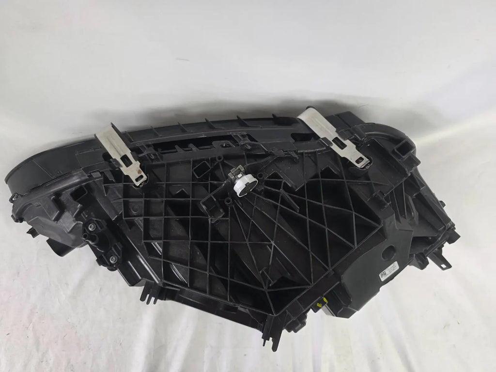 Used genuine BMW LED headlight for 4 Series models including G22, G23, G26, G80, G82, and G83. This left-side OEM headlamp, part number 9851035, is designed to perfectly fit and function in compatible BMW vehicles. The image shows the original BMW LED headlight in used condition with visible connectors, housing, and lens – ideal for replacement or repair of your vehicle’s front lighting system.

