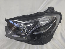 Load image into Gallery viewer, This image displays the left-side Multibeam LED headlight with blue accents for the Mercedes-Benz E-Class W213, featuring OEM genuine quality and part number A2139066504. This original used headlamp is designed for precise fitment on the W213 model, offering advanced Multibeam LED technology with distinctive blue detailing for high-performance adaptive illumination and premium styling