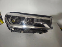 Load image into Gallery viewer, This image features the right-side Adaptive LED headlight (ICON design) for the BMW 7 Series G11 and G12 models, showcasing OEM genuine quality with part number 7408710. This used original headlamp offers BMW’s signature Adaptive LED with ICON styling, providing dynamic lighting performance, precise fitment, and premium functionality tailored for the luxury 7 Series lineup.