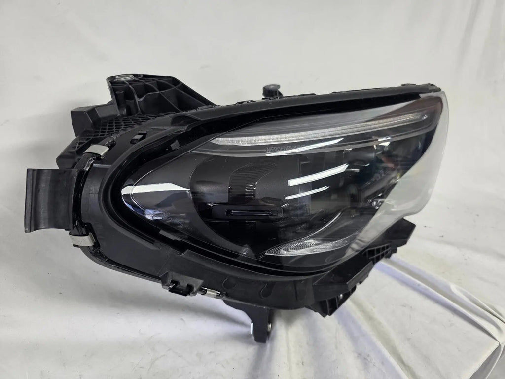 This image showcases the OEM genuine DIGITAL LIGHT headlights for the Mercedes-Benz E-Class W214, available for both right and left sides with part numbers A2149066102 (right) and A2149066202 (left). These advanced headlamps are original Mercedes-Benz components designed for the W214 model, offering cutting-edge DIGITAL LIGHT technology that enhances driving safety and precision lighting. The headlights are used but maintain high-quality OEM standards and are ideal replacements for the corresponding side.