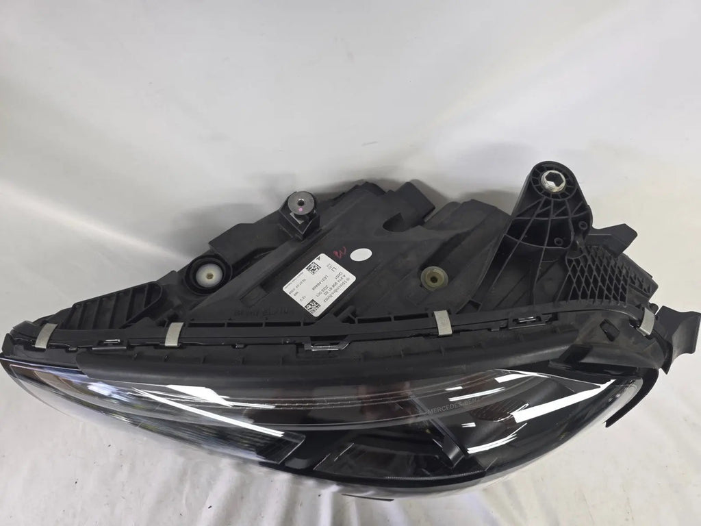 This image shows the left-side DIGITAL LIGHT headlight for the Mercedes-Benz E-Class W214, featuring OEM genuine quality with part number A2149066102. Designed for a precise fit on the left side of the W214 model, this used original headlamp offers Mercedes-Benz’s advanced DIGITAL LIGHT technology for superior adaptive illumination and driving safety.