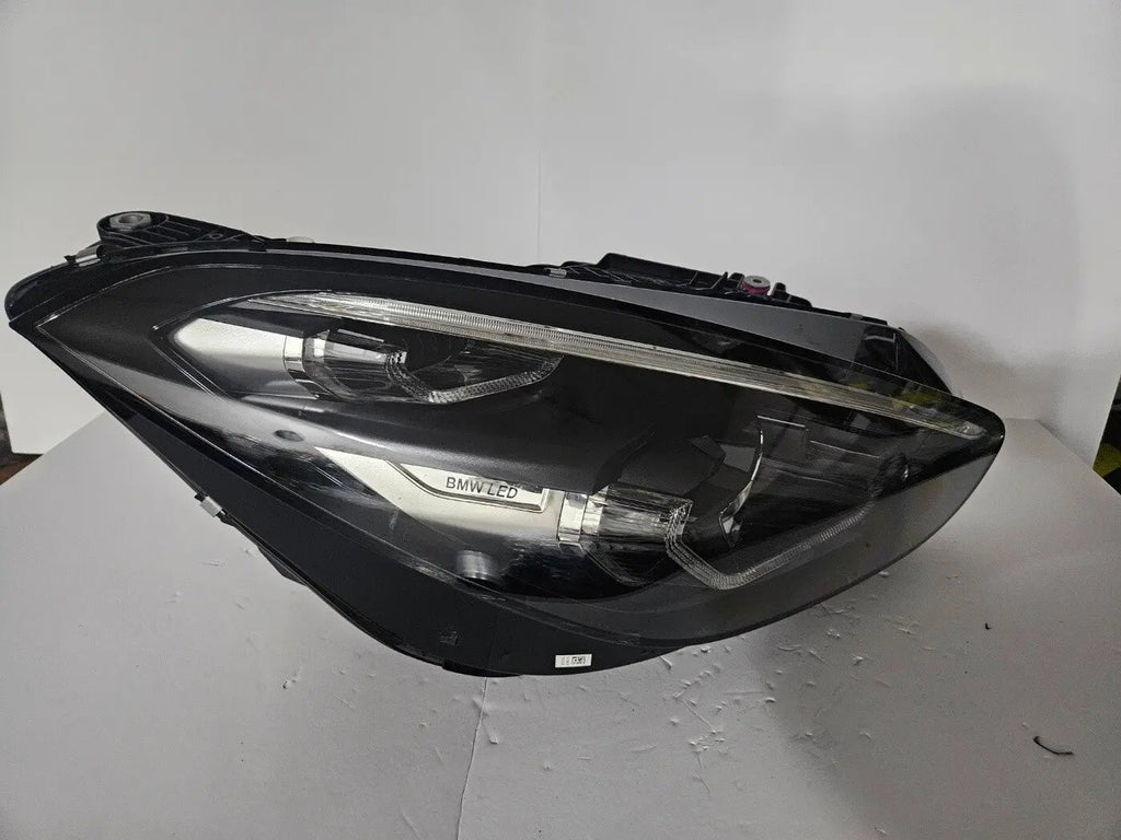 This image shows the right-side LED headlight for the BMW Z4 G29 model, featuring OEM genuine quality with part number 5A2DB96. This used original headlamp is designed for a precise fit on the G29, delivering bright LED illumination, sporty styling, and reliable performance that complements the dynamic design of the BMW Z4.