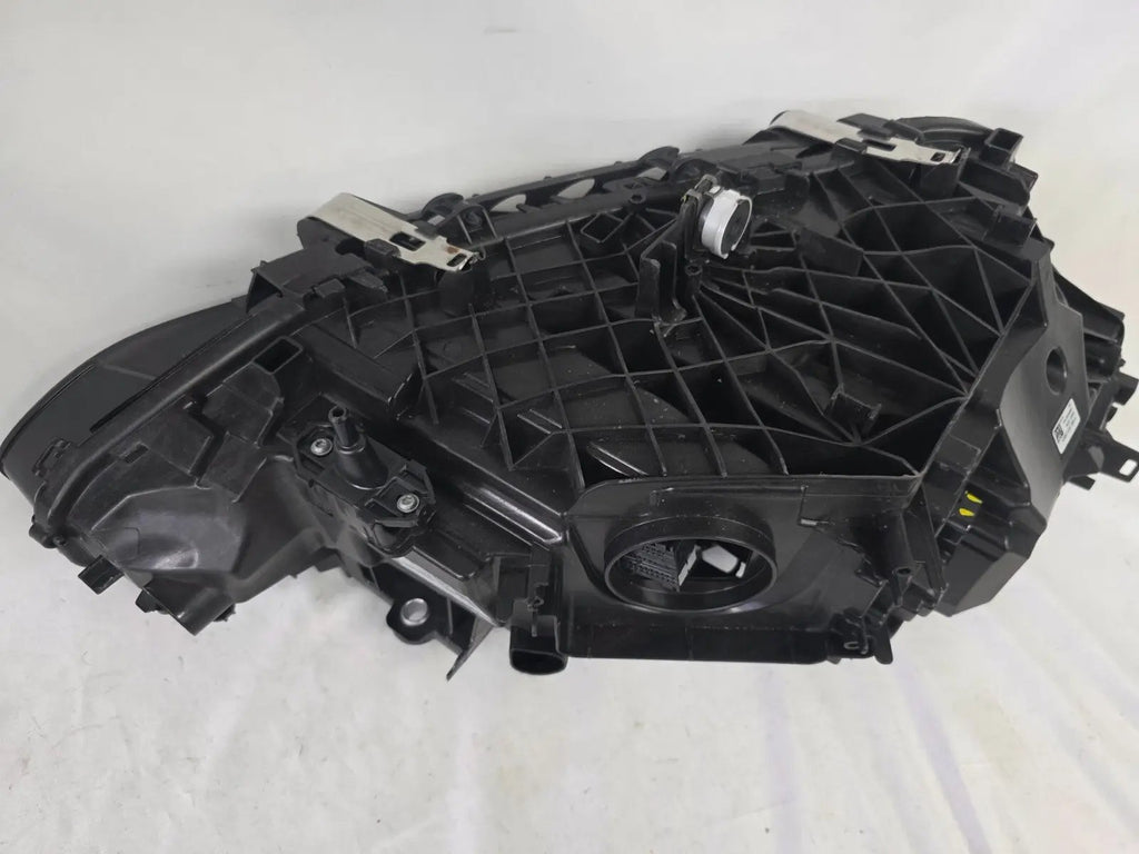 Used genuine BMW LED headlight for 4 Series models including G22, G23, G26, G80, G82, and G83. This left-side OEM headlamp, part number 9851035, is designed to perfectly fit and function in compatible BMW vehicles. The image shows the original BMW LED headlight in used condition with visible connectors, housing, and lens – ideal for replacement or repair of your vehicle’s front lighting system.