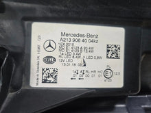 Load image into Gallery viewer, This image features the right-side LED High Performance headlight for the Mercedes-Benz E-Class W213, showcasing OEM genuine quality with part number A2139064004. Specifically designed for the W213 model, this used headlight offers high-performance LED illumination and is an original Mercedes-Benz component, ensuring precise fit and reliable functionality