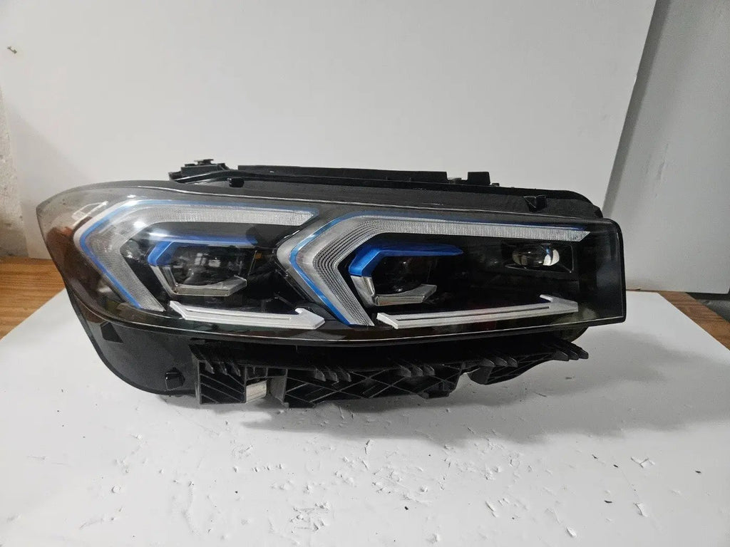 This image features the right-side Adaptive LED headlight for the BMW 3 Series G20 LCI and G21 LCI models, with OEM genuine quality and part number 5A1A354. This used original headlamp is designed for the facelifted versions, offering precise fitment, dynamic beam control, and advanced Adaptive LED technology to enhance visibility and maintain the sleek, modern appearance of the 3 Series.