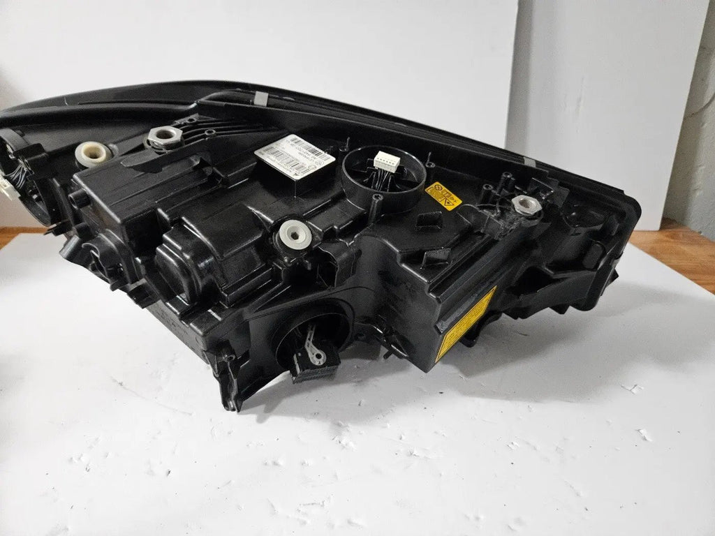 Genuine used BMW Laser headlight for 3 Series models G20 and G21. This left-side OEM headlamp, part number 9481707, features high-performance laser lighting technology for superior road visibility and driving precision. The image showcases the original left laser headlight in used condition, clearly showing the lens structure, housing, and connector ports — ideal for replacing a damaged headlamp on compatible BMW 3 Series vehicles.

