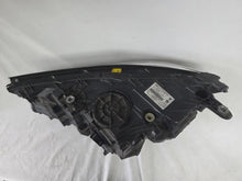Load image into Gallery viewer, Used genuine BMW Laser headlight for 7 Series models G11 and G12. This right-side OEM headlamp, part number 7465606, features advanced laser lighting technology for superior visibility and performance. The image shows the original BMW right laser headlight in used condition, highlighting the detailed lens design, housing structure, and connector ports — ideal for high-end replacement or repair on compatible 7 Series vehicles.

