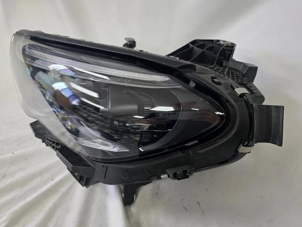 This image shows the left-side DIGITAL LIGHT headlight for the Mercedes-Benz E-Class W214, featuring OEM genuine quality with part number A2149066102. Designed for a precise fit on the left side of the W214 model, this used original headlamp offers Mercedes-Benz’s advanced DIGITAL LIGHT technology for superior adaptive illumination and driving safety.