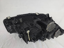 Load image into Gallery viewer, Genuine OEM BMW Laser headlight for 5 Series models G30, G31, and F90 LCI (facelift). This left-side headlamp, part number 5A388D5, is equipped with advanced laser lighting technology for superior visibility and precision on the road. The image displays the original left laser headlight in used condition, clearly showing the lens structure, cooling fins, mounting points, and connector ports — ideal for OEM replacement on compatible BMW 5 Series LCI vehicles.


