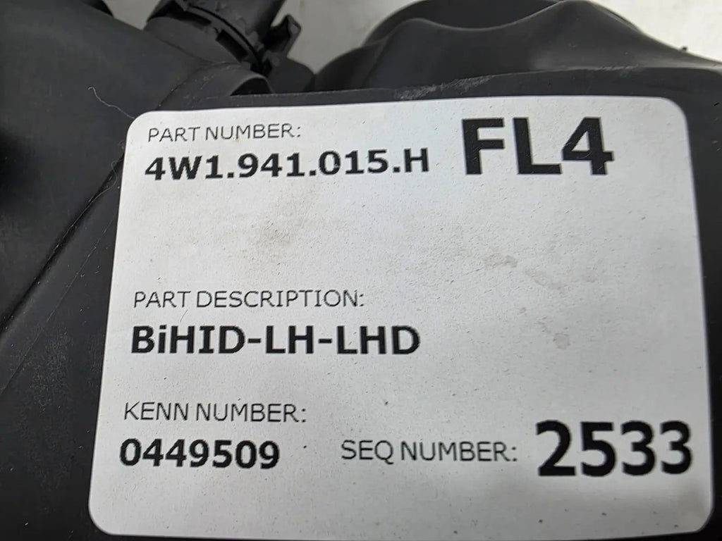 This image shows the left-side headlight for the 2014–2019 Bentley Flying Spur, featuring OEM genuine quality with part number 4W1941015H. This used original headlamp is in excellent condition, offering premium illumination, elegant design, and a precise fit for Bentley’s high-end luxury sedan
