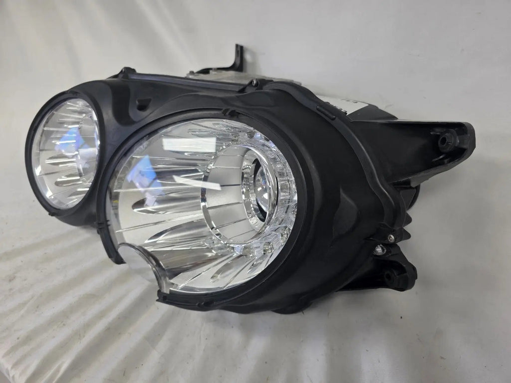 This image shows the left-side headlight for the 2014–2019 Bentley Flying Spur, featuring OEM genuine quality with part number 4W1941015H. This used original headlamp is in excellent condition, offering premium illumination, elegant design, and a precise fit for Bentley’s high-end luxury sedan