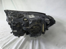 Load image into Gallery viewer, Used genuine BMW Laser headlight for 7 Series models G11 and G12. This right-side OEM headlamp, part number 7465606, features advanced laser lighting technology for superior visibility and performance. The image shows the original BMW right laser headlight in used condition, highlighting the detailed lens design, housing structure, and connector ports — ideal for high-end replacement or repair on compatible 7 Series vehicles.