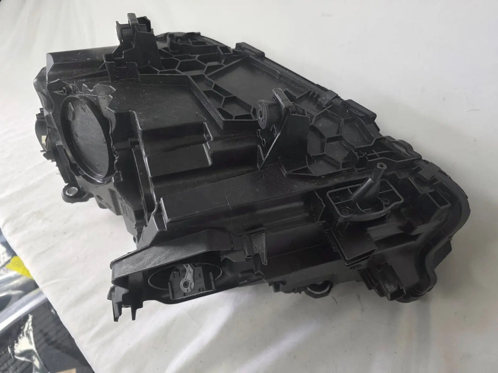 Genuine OEM Adaptive LED headlight for BMW iX3 and compatible models including G08, G01, F97, G02, and F98 with LCI (facelift) updates. This right-side headlamp, part number 5A29204, features adaptive lighting technology for enhanced road illumination and driving safety. The image showcases the original right LED headlight in used condition, clearly showing the lens, housing, and connector points — perfect for replacement on BMW iX3 and related LCI models.
