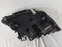 Load image into Gallery viewer, Genuine OEM BMW Laser headlight for 5 Series models G30, G31, and F90 LCI (facelift). This left-side headlamp, part number 5A388D5, is equipped with advanced laser lighting technology for superior visibility and precision on the road. The image displays the original left laser headlight in used condition, clearly showing the lens structure, cooling fins, mounting points, and connector ports — ideal for OEM replacement on compatible BMW 5 Series LCI vehicles.

