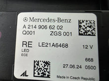 Load image into Gallery viewer, This image showcases the OEM genuine DIGITAL LIGHT headlights for the Mercedes-Benz E-Class W214, available for both right and left sides with part numbers A2149066102 (right) and A2149066202 (left). These advanced headlamps are original Mercedes-Benz components designed for the W214 model, offering cutting-edge DIGITAL LIGHT technology that enhances driving safety and precision lighting. The headlights are used but maintain high-quality OEM standards and are ideal replacements for the corresponding side.