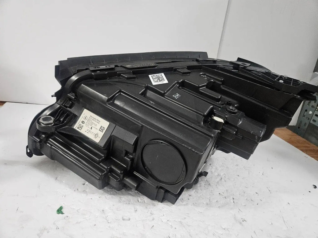 This image features the right-side LED High Performance headlight for the Mercedes-Benz E-Class W213, showcasing OEM genuine quality with part number A2139064004. Specifically designed for the W213 model, this used headlight offers high-performance LED illumination and is an original Mercedes-Benz component, ensuring precise fit and reliable functionality