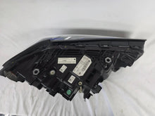 Load image into Gallery viewer, Genuine OEM BMW Laser headlight for 5 Series models G30, G31, and F90 LCI (facelift). This left-side headlamp, part number 5A388D5, is equipped with advanced laser lighting technology for superior visibility and precision on the road. The image displays the original left laser headlight in used condition, clearly showing the lens structure, cooling fins, mounting points, and connector ports — ideal for OEM replacement on compatible BMW 5 Series LCI vehicles.

