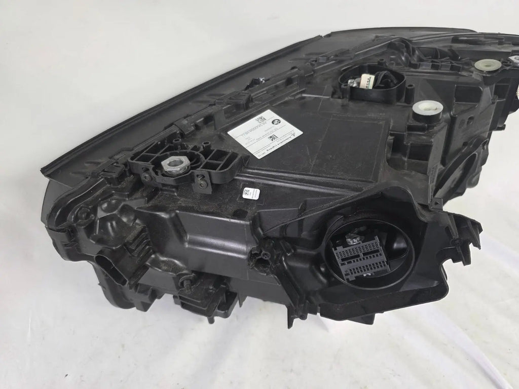 Genuine OEM Adaptive LED headlight for BMW iX3 and compatible models including G08, G01, F97, G02, and F98 with LCI (facelift) updates. This right-side headlamp, part number 5A29204, features adaptive lighting technology for enhanced road illumination and driving safety. The image showcases the original right LED headlight in used condition, clearly showing the lens, housing, and connector points — perfect for replacement on BMW iX3 and related LCI models.
