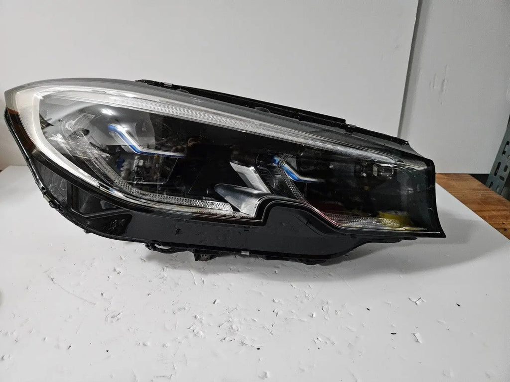This image shows the right-side Laser headlight for BMW 3 Series G20 and G21 models, featuring OEM genuine quality with part number 9481708. This used original headlamp offers advanced BMW Laserlight technology for superior road illumination, precise fitment, and a sleek, high-performance design tailored to the modern styling of the 3 Series.